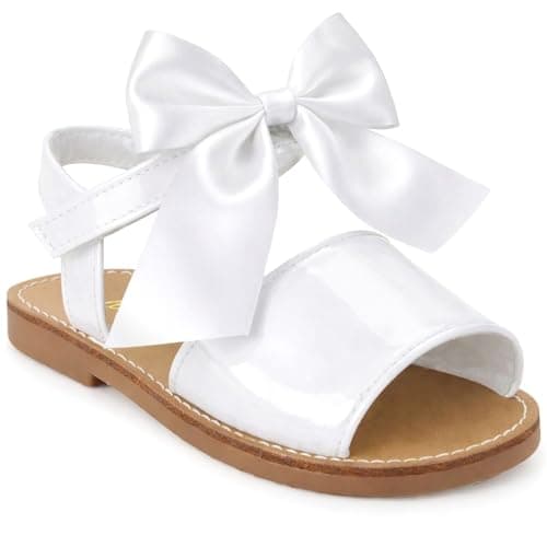 Image of Melia Kids Girls Spanish Bow Sandals Shiny Patent Menorcan Style Baby White Pink Camel Navy Blue (White, UK Footwear Size System, Little Kid, Women, Numeric, Medium, 4)