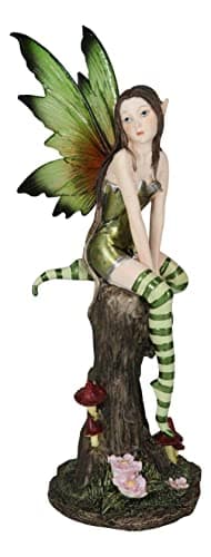 Image of Ebros Gift Whimsical Peppermint Tribal Elf Holiday Christmas Fairy Sitting On Tree Stump Figurine 9.5" Tall Mythical Tribal Holiday Faerie Fantasy Sculpture