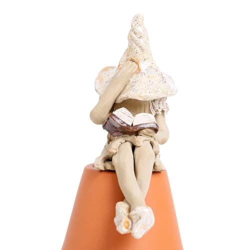Image of Fairy garden shy fairy figurine, pixie plant pot ornament reading her book, speckled cream.
