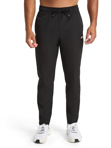 Image of Reebok Apparel Men's Dominator Pant, Standard Fit, 30” Inseam, Lightweight Stretch Poly Fabric, Black, Medium