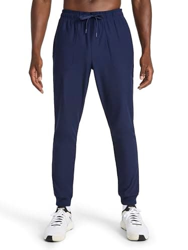 Image of Reebok Apparel Men's Striker Pant, Standard Fit, 30” Inseam, Lightweight Poly Fabric, Vector Navy, Large