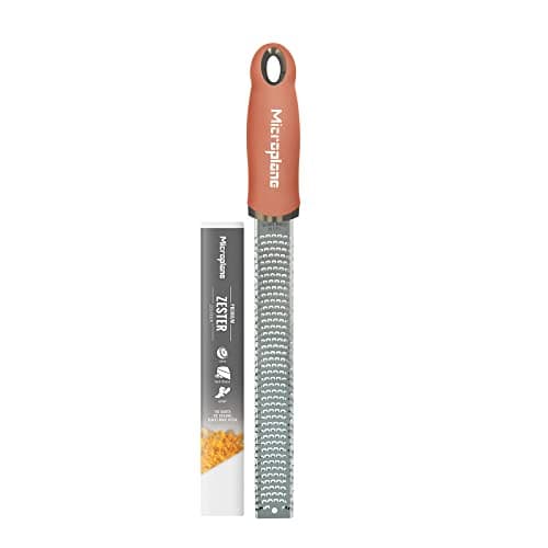 Image of Microplane Zester Grater in Cinnamon Orange for Citrus Fruits, Hard Cheese, Ginger, Chocolate and Nutmeg with Fine Stainless Steel Blade - Made in USA
