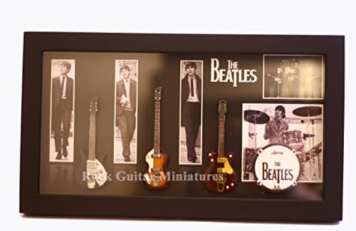 Image of RGM8868 Beatles Miniature Guitar Collection includes three mounted replica Beatles miniature guitars bass drum in a shadowbox frame. A delightful gift for any Beatles fan