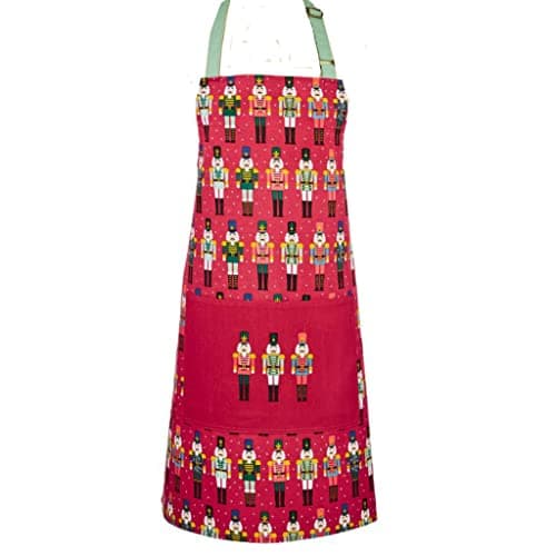 Image of Ulster Weavers - Christmas Nutcracker Apron (70 x 80cm) - 100% Cotton - 1x Pocket - Washable - Nutcracker Soldiers Apron for Christmas - Red Xmas Apron for Chef - Christmas Kitchen Decorations