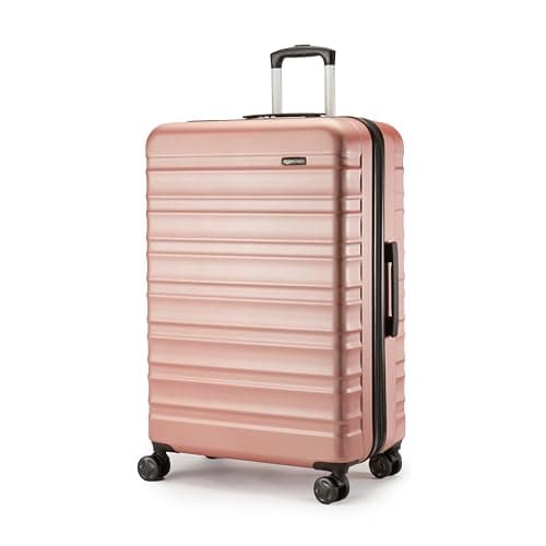 Image of Amazon Basics Hard Shell Large Suitcase - Expandable ABS Travel Luggage with 4 Double Spinner Wheels - Scratch Resistant and Lightweight Construction - 78 x 52.6 x 32cm - Rose Gold