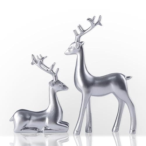 Image of 2PCS Elegant Christmas Reindeer Figurine, Resin Standing Sitting Xmas Deer Statues Elk Sculpture, Creative Animal Craft Tabletop Ornaments for Mantel Fireplace Table Centerpieces Home Décor (Silver)