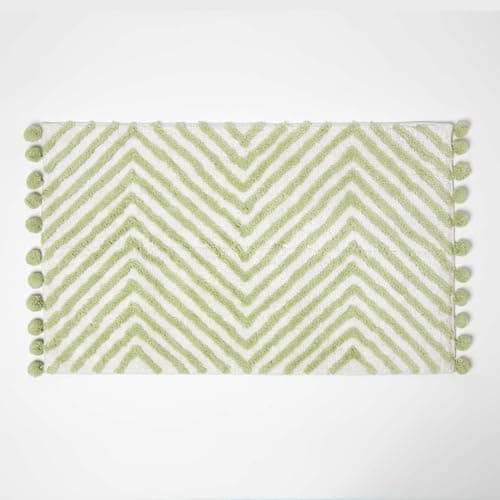 Image of HOMESCAPES Sage Green Cotton Bath Mat with Zig Zag Design Super Absorbent Tufted Bathmat with Pom Poms, 50 x 80 cm
