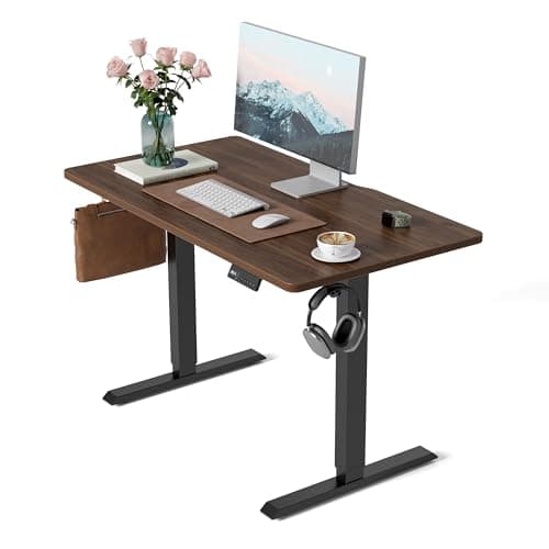 Image of FEZIBO Electric Height Adjustable Standing Desk with digital display control panel, 60x100cm Ergonomic Home Office Table for sit stand with Splice Board & Black Walnut Wood Grain Surface.