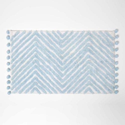Image of HOMESCAPES Blue Cotton Bath Mat with Zig Zag Design Super Absorbent Tufted Bathmat with Pom Poms, 50 x 80 cm