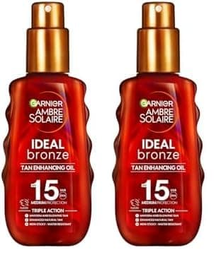 Image of Garnier Ambre Solaire Ideal Bronze Protective Oil Sun Cream SPF15, High Sun Protection Factor 15, Shea Butter, Water Resistant & Non Greasy Sunscreen, UVA & UVB Protection, 150ml (Pack of 2)