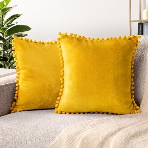 Image of PAVILIA Mustard Yellow Throw Pillow Covers Pom Pom 20x20 Set of 2, Decorative Pillow Cases Bed Sofa Couch, Boho Accent Decor Fleece Cushion Bedroom Living Room, Velvet Square Euro Sham Pompoms, Gold