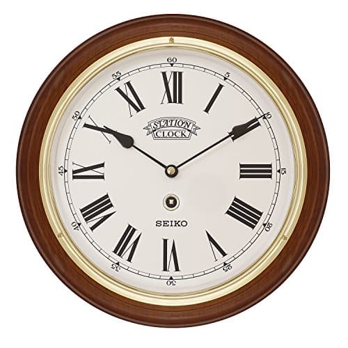 Image of Seiko Dark Wooden Quartz/Battery Round Station Wall Clock with Gold Coloured Bezel, White Dial & Roman Numerals. QXA143B