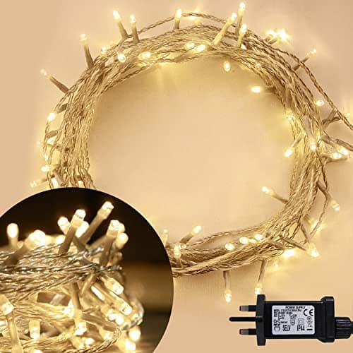 Image of ANSIO® Christmas Lights 100 LED 10m/32ft Christmas Tree Lights for Indoor & Outdoor Warm White Decorations Fairy String Lights for Xmas Garden Bedroom & Party | Mains Powered Clear Cable