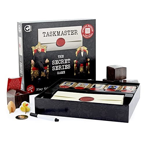 Image of Ginger Fox Taskmaster The Board Game Secret Series Special Edition. Bring the TV Show Home And Compete In Hilarious Tasks With Friends And Family To Be Crowned The Series Champion Series