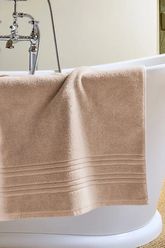 Image of Christy CHRISTY 'Serene' Pastel 100% Combed Cotton Bath Mat in Natural Natural One Size Unisex 5057241204211