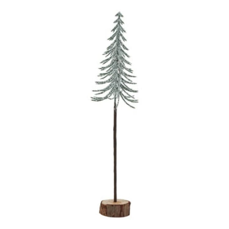 Image of Large Snowy Spindle Tree In Wood Log