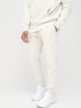 Image of Nike Sportswear Club Joggers - Stone