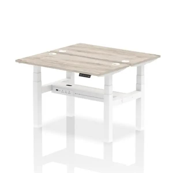 Image of Air Air Back-to-Back 1200 x 600mm Height Adjustable 2 Person Bench Desk Grey Oak Top with Cable Ports White Frame HASCP2P12600GRYW