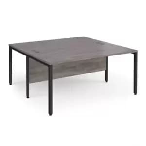 Image of Maestro 25 back to back straight desks 1600mm x 1600mm - Black bench leg frame and grey oak top