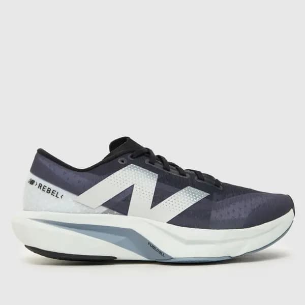 Image of New Balance fuelcell rebel v4 trainers in navy & white