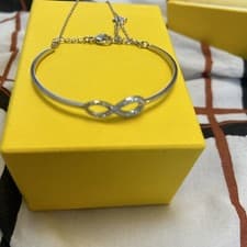 Image of Genuine Swarovski Infinity White Crystal Bangle 5520584 RRP £95