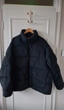 Image of Adidas Originals puffer coat in black. *Patch pockets *Regular fit