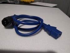 Image of IEC C13 female connector on one end and an IEC C14 male connector on the other.
