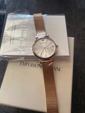 Image of armani watch women new,still in the box with plastic cover over the watch