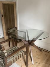 Image of round Glass And walnut dining table