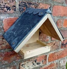 Image of Bird table/bird feeder With slate roof and lead ridge