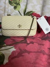 Image of Tory Burch Kira Moto Quilt Mini Flap Leather Crossbody Bag in Lemon Swirl/$358