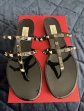 Image of Valentino Garavani Rockstud rubber flat sandals in black