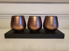 Image of Hestia Set of 3 Glass Votive Tea Light Holders On Wooden Plinth