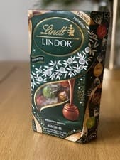 Image of Lindt Lindor Assorted Chocolate Truffles with Pistachio Limited Edition 337g