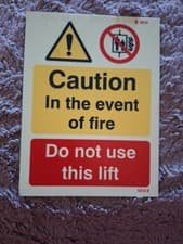 Image of Caution In The Event Of Fire Do Not Use This Lift Sturdy Plastic Sign 15 X 20 Cm