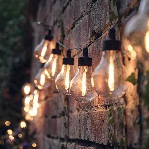Image of Lights4fun 4.75m Outdoor Battery Operated Festoon String Lights – 20 Warm White LED Clear Bulbs – 8 Modes – IP44 Waterproof – Garden Lighting for Patios, Porches, Lawns, Exterior Walls